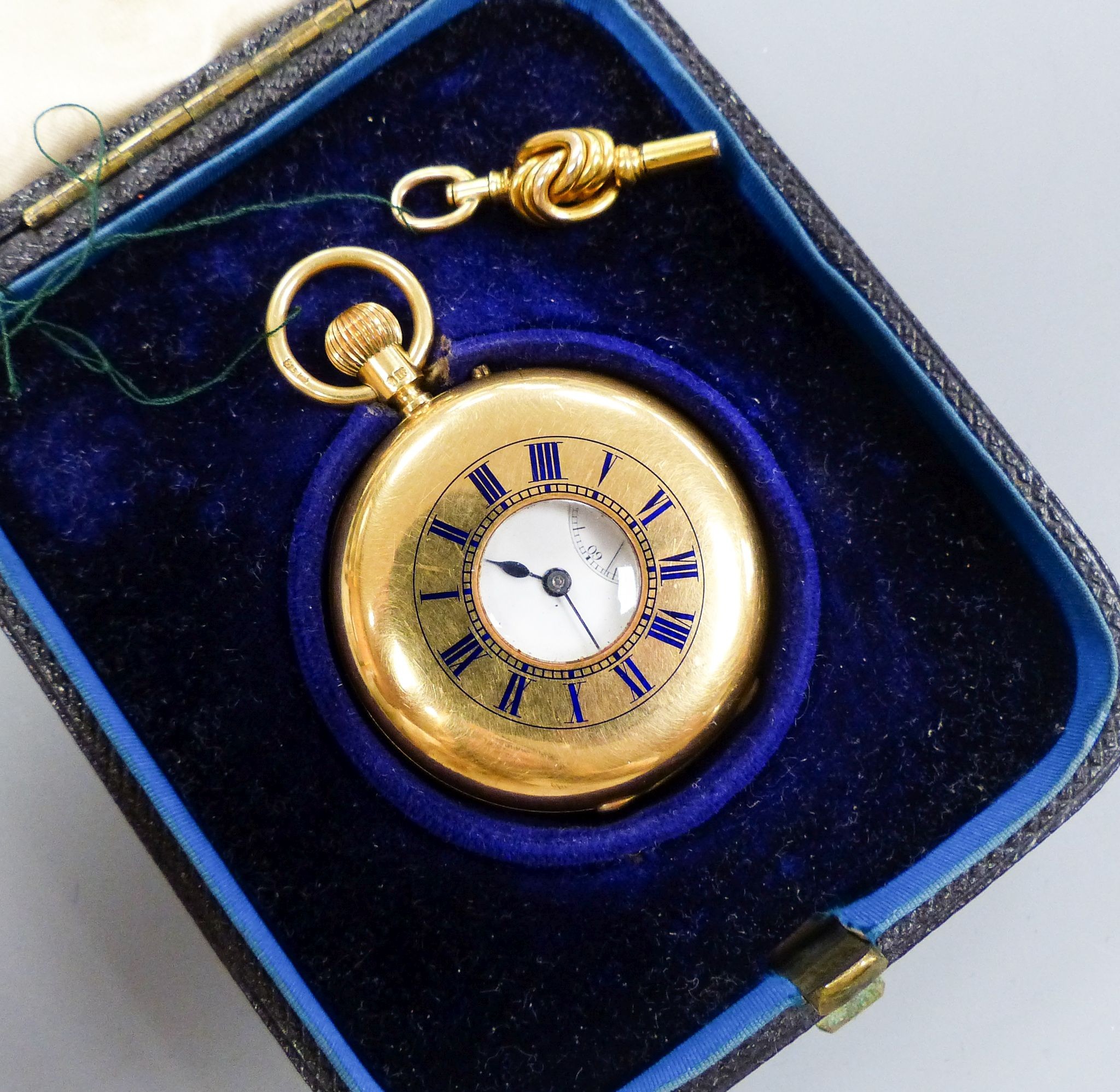 A cased late Victorian 18ct gold half hunter pocket watch, by Carrington & Co, with signed movement, case diameter 37mm, gross weight 62.1 grams, with key.